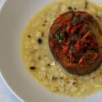 Corn chowder - creamed corn with a seared potato "scallop" and a tomato, pepper and parsley salad.