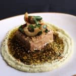 House smoked tofu over a fava bean hummus, with dukkah spice and a green olive salad.