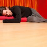 yoga pose on cushion