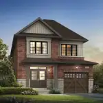 Exterior rendering of a 30' detached two-story home at Caledon Trails, featuring red brick masonry, a single-car garage with a wooden door, and professional landscaping.