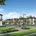 Wide-angle view of the Esprit Newmarket community streetscape showing beautifully landscaped walkways, street lamps, and a row of contemporary detached homes under a clear blue sky.