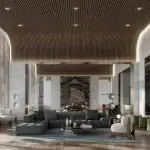 A luxury modern resident lounge at The Greenwich featuring a curved wood-slat ceiling, marble fireplace, and contemporary designer furniture including a grey sectional sofa and white accent chairs.