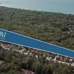 Aerial view of the Shoreline Point development site in Wasaga Beach, highlighting the community's proximity to lush forests and the Georgian Bay shoreline.