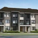 Modern dual-front townhomes at Vicinity featuring grey brick, dark siding, and large windows.