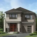 Modern detached home at Vicinity with a single car garage, stone facade, and orange front door.