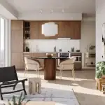 Modern open-concept interior of a suite at Kipling Station Condos, featuring a wood-grain kitchen, marble backsplash, a round dining table with velvet chairs, and large floor-to-ceiling windows.