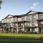 Street-level exterior rendering of Brooklin Towns 2.0 townhouses by Madison Group, featuring modern white brick and board-and-batten siding with private balconies, overlooking a sunny green lawn where children are playing soccer.