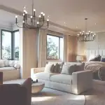 Luxurious primary suite at King’s Calling featuring a king-sized bed with a tall upholstered headboard, a private sitting area with a sofa, two elegant black chandeliers, and large bay windows.