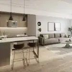 Open concept interior of a suite at The Kith Condominiums featuring a modern kitchen island and bright living room.