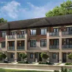 Exterior rendering of modern urban townhomes at The Enclave at Sharon Village, featuring a mix of red brick and light stone facades, glass-railed balconies, and professional landscaping under a blue sky.
