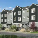 Exterior rendering of a multi-story building at The Grove Townhomes at Wildflower, featuring modern dark grey and light grey siding, stone accents, and landscaped front entryways under a blue sky.