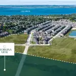 Aerial drone view of the Georgina View community site in Keswick, highlighting its proximity to Lake Simcoe, adjacent Georgina Heights neighborhood, and surrounding green spaces.