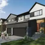 East Hills Crossing - Front Drive Towns Exterior rendering of East Hills Crossing Front Drive Townhomes showing modern architectural design with mixed siding, integrated garages, and family-friendly streetscape.