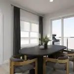 Contemporary dining area at Poppy at Rangeview Auburn model showing a black oval dining table with gold-framed chairs next to a sliding glass door leading to a private balcony.