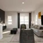 Spacious living room in the Auburn model at Poppy at Rangeview featuring a grey sofa, black accent chairs, a dark wood slat feature wall, and large windows with black drapery.