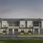 Architectural rendering of modern townhomes at Triple Crown Estates by Remington Homes, displaying a grey brick exterior with integrated garages and large windows under a dusk sky.