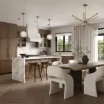 Open-concept luxury kitchen and dining area in a Riverview South Oakville home featuring wood cabinetry, marble waterfall island, herringbone hardwood floors, and a modern sunburst chandelier over a white textured dining set.