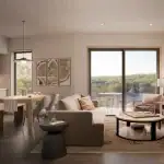 Open-concept living room in a Calabogie Peaks townhome featuring modern furniture, large sliding glass doors, and a natural wood dining table.
