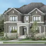 Traditional brick and stone freehold townhome exterior by Greenpark Group in the Unionglen community, Markham, featuring a classic gabled roof and arched entryway.