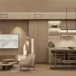 Modern open-concept interior of an Ellia at Unity townhouse, featuring a minimalist kitchen with stone backsplashes, a warm wood-paneled living area, and contemporary light fixtures in a neutral color palette.