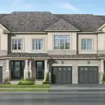 Architectural rendering of a modern townhome block at On The Ridge, featuring a mix of stone and stucco exteriors, dark garage doors, and elegant gabled rooflines under a clear blue sky.