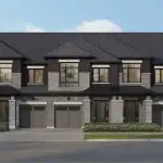 Heartwood Village - Towns 1 Exterior rendering of Heartwood Village townhomes featuring grey stone and dark brick architecture, integrated garages, and covered front entryways.