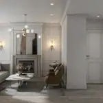 Open-concept luxury living room at Thornhill Heights with a stone fireplace, modern gold chandelier, neutral furniture, and view of the kitchen.