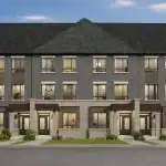 Architectural rendering of a modern block of 3-storey Glenway Towns featuring dark grey brick exteriors, light stone accents, and large windows under a dusk sky.