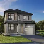 Exterior of a 32-foot detached single-family home at Newbrook featuring grey brick, wood accents, and a single-car garage.