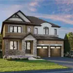 Exterior of a luxury 43-foot detached home at Newbrook featuring a stone and brick facade, double-car garage, and gabled roofline.