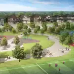 Aerial view of the community park at Newbrook featuring a playground, splash pad, basketball court, and tennis courts surrounded by greenery.