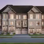 Architectural rendering of a row of modern Street Towns at Vellore Trails, featuring multi-toned brick exteriors, stone accents, large windows, and integrated garages under a dusk sky.