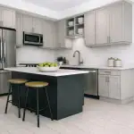 Modern open-concept kitchen in West Community with light grey shaker cabinets, a dark navy center island with seating, stainless steel appliances, and white subway tile backsplash.