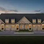 Exterior rendering of a row of bungaloft townhouses at Harwood Place, showcasing a classic design with beige board-and-batten siding, pitched gables, dormer windows, and attached garages.
