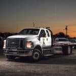 24/7 Tow truck phoenix az. Freeway Towing & Storage. Freeway Towing & Storage flatbed tow truck in Phoenix AZ at sunset