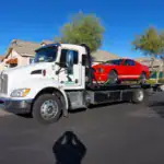 Freeway Towing & Storage flatbed tow truck responding to a breakdown along I-17 and the Loop 101 corridor in North Phoenix, Arizona