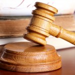 Judges gavel with very old books | Steven Ameche