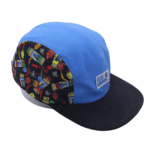 Blue camp hat wit Secret Aardvark logo patch on from and side panels of hat with decorative fabric
