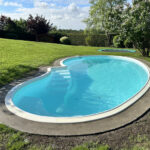 Referenzen 7 ©Terramore-Bodendesign_IMG_1147 Pool mit Steinteppich Umrandung