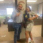 Client celebrating successful case outcome with The Texas Bulldog team in Houston.