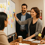 A diverse team of professionals gathered around a table in discussion. This symbolizes the opportunity to connect with The Macro Lens for collaboration across social work, nonprofits, and the social service sector to advance systemic change.