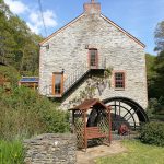 Wheel on side of mill