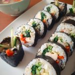 Chicken kimbap rolls with kelp soup in the background