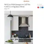 Black and white kitchen with hexagonal tile backsplash and modern appliances.