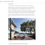 Contemporary modern house with large glass windows, minimalist wooden deck, and a sleek pool area under a blue sky.