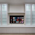 Custom-made entertainment unit in Hornsby. Poly painted in vivid white. This Was made for a customer who wants to display his collection of navy memorabilia. All with soft close, push touch glass doors and led down lights.