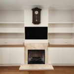 Custom Alcove Cabinets for a Turramurra Home We designed and built a beautiful set of custom alcove cabinets for a customer in Turramurra. These cabinets have blackbutt veneer for the countertops which match free float shelves and cabinets which are painted in a soft cream-colored poly paint. The cabinets are on either side of a central integrated TV unit and fireplace, maximizing the storage and display space in this area of the home. The alcove units have lovely free-floating shelves that provide open and airy storage solutions. Both the alcove units feature soft close doors with a smooth push-to-open mechanism, adding convenience. We specialize in hand-crafting custom cabinets that are designed specifically for our customer's homes and needs. Contact us today to discuss how we can create the perfect custom cabinets for your next project.