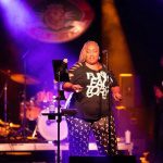 African American woman singing on stage at a live music venue in Eureka Springs, Arkansas.