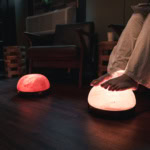 Relaxing foot massage with glowing salt lamps in a cozy spa setting at Basin Park Hotel.
