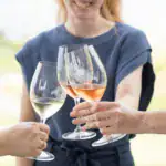 3 glasses of poplar grove wines coming together for a cheers